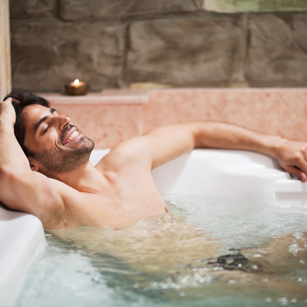 Man relaxing in hot tub
