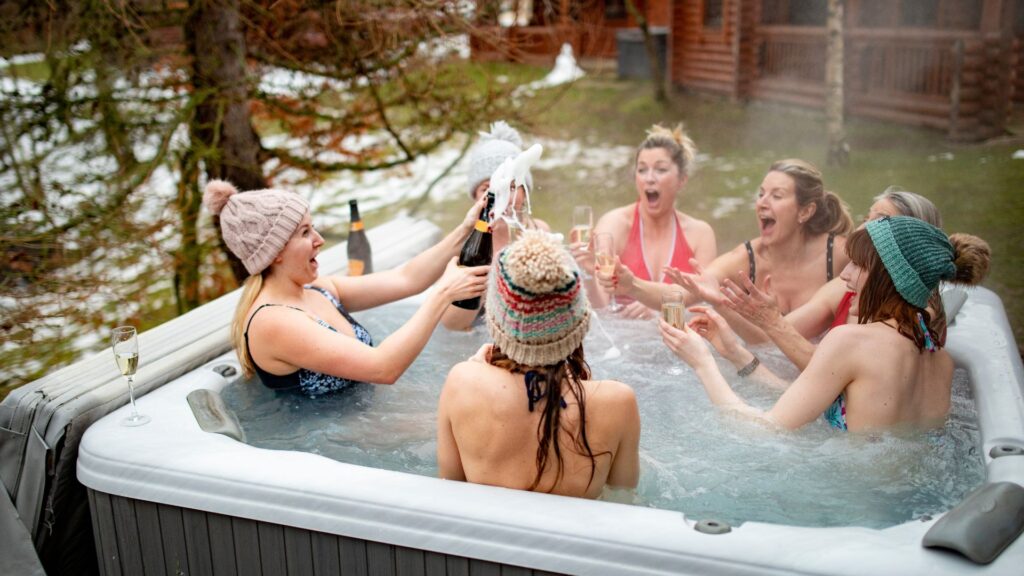 A group of women sitting in a hot tub