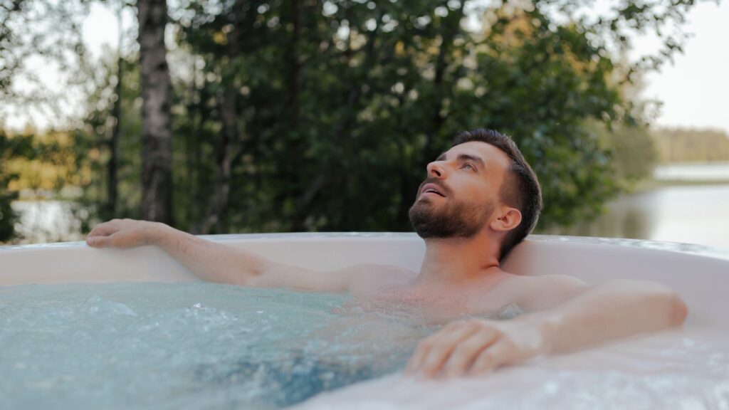 A man sitting in his hot tub